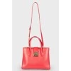 Red bag in the shape of a trapezoid