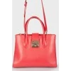 Red bag in the shape of a trapezoid