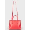 Red bag in the shape of a trapezoid