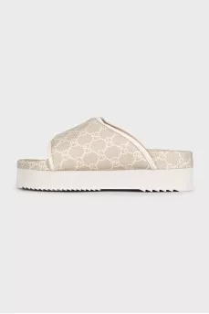 Beige canvas slides with tag