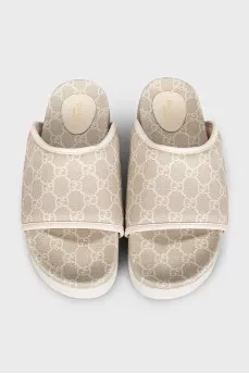 Beige canvas slides with tag