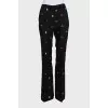 Black suit with trousers decorated with embroidery