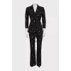 Black suit with trousers decorated with embroidery