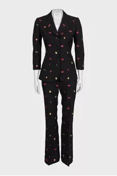 Black suit with trousers decorated with embroidery