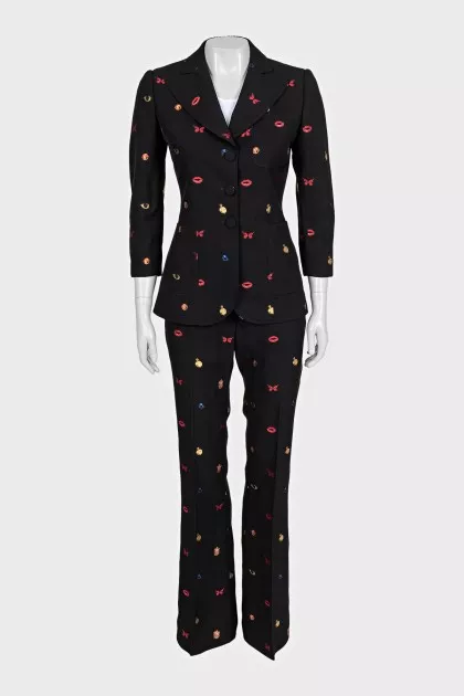 Black suit with trousers decorated with embroidery