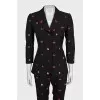 Black suit with trousers decorated with embroidery