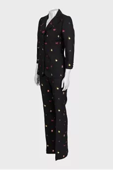 Black suit with trousers decorated with embroidery