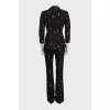 Black suit with trousers decorated with embroidery
