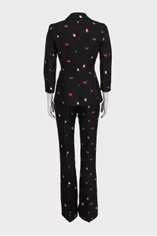 Black suit with trousers decorated with embroidery