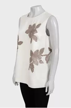 Beige short-sleeved blouse decorated with sequins