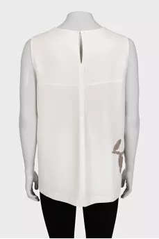 Beige short-sleeved blouse decorated with sequins