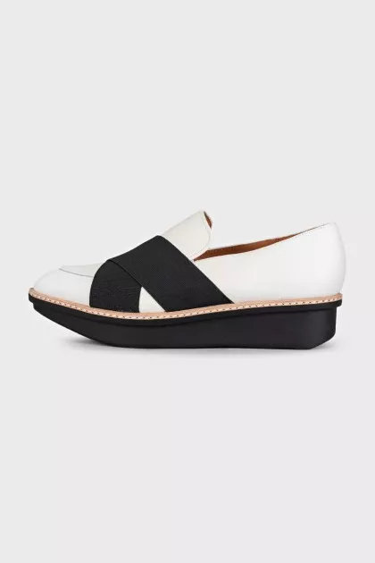 Black and white textile slip-ons
