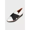 Black and white textile slip-ons