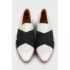 Black and white textile slip-ons