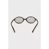 Oval glasses with leopard print frames