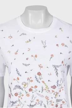 A straight white T-shirt decorated with rhinestones