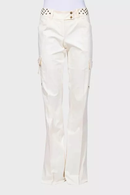 Flared trousers decorated with eyelets