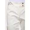 Flared trousers decorated with eyelets
