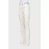 Flared trousers decorated with eyelets