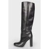 Black leather heeled boots with a wide boot