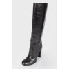Black leather heeled boots with a wide boot