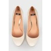White leather stilettos