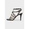 Leather sandals with gold-tone heel embellishments