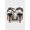 Leather sandals with gold-tone heel embellishments
