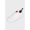 White sneakers with accent decor