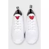 White sneakers with accent decor