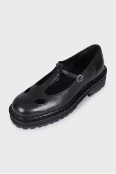Black leather shoes with cutouts