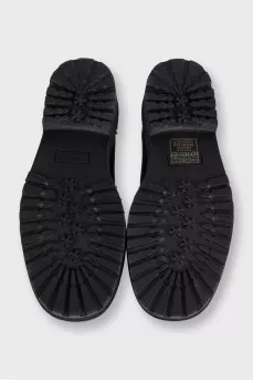 Black leather shoes with cutouts