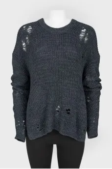 Dark blue knitted sweater of a free cut