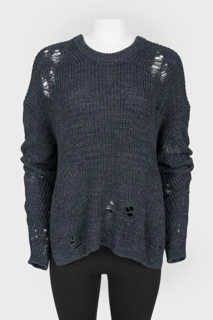 Dark blue knitted sweater of a free cut