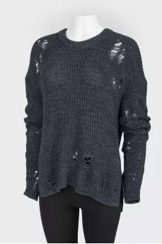Dark blue knitted sweater of a free cut