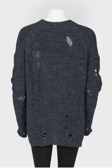 Dark blue knitted sweater of a free cut