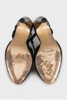 Black slingbacks with gold heels