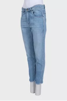 Tapered jeans with raw hem