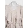 Loose-fitting ruffle blouse with tag