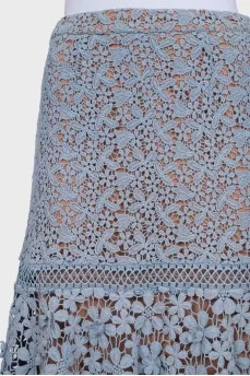 Lace skirt with an asymmetrical hem