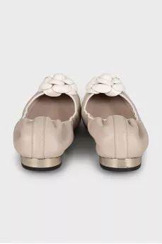 Beige ballet flats decorated with a flower