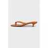 Orange embossed heeled flip flops