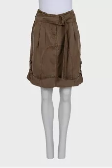 Denim skirt decorated with buckles
