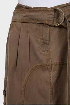 Denim skirt decorated with buckles