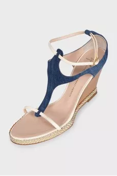 Textile sandals with leather straps on a wedge heel