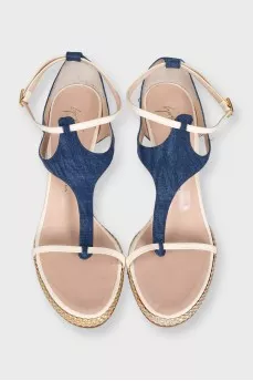 Textile sandals with leather straps on a wedge heel