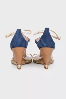 Textile sandals with leather straps on a wedge heel