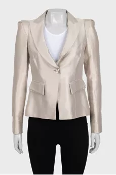 A cropped fitted jacket with a button