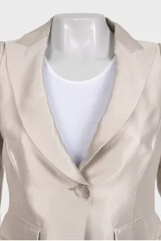 A cropped fitted jacket with a button