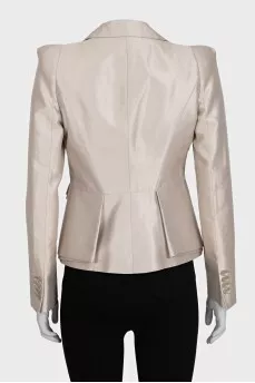 A cropped fitted jacket with a button
